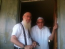 Rabbi Hecht helping Max Solomon put up his Mezuza